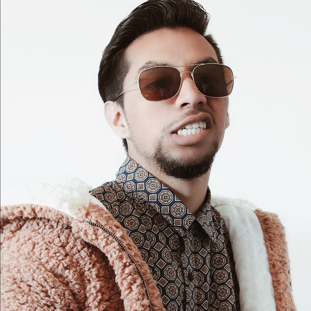 An H&M multi-patterned print button-up dress shirt